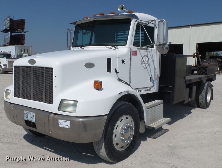 1997 Peterbilt 330 flatbed truck - DE7995