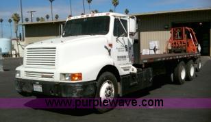 1991 International 8300 flatbed semi truck with truck mounted forklift - 1001