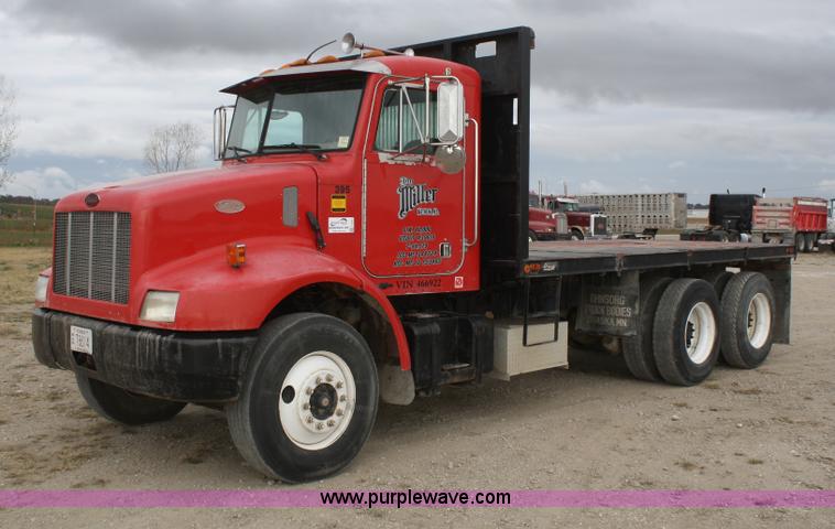 1999 Peterbilt 330 flatbed semi truck - F2643