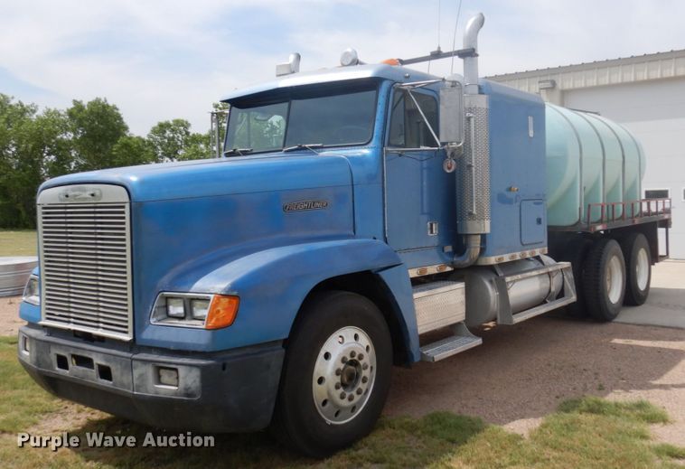 1989 Freightliner FLD120  flatbed truck - JZ9994