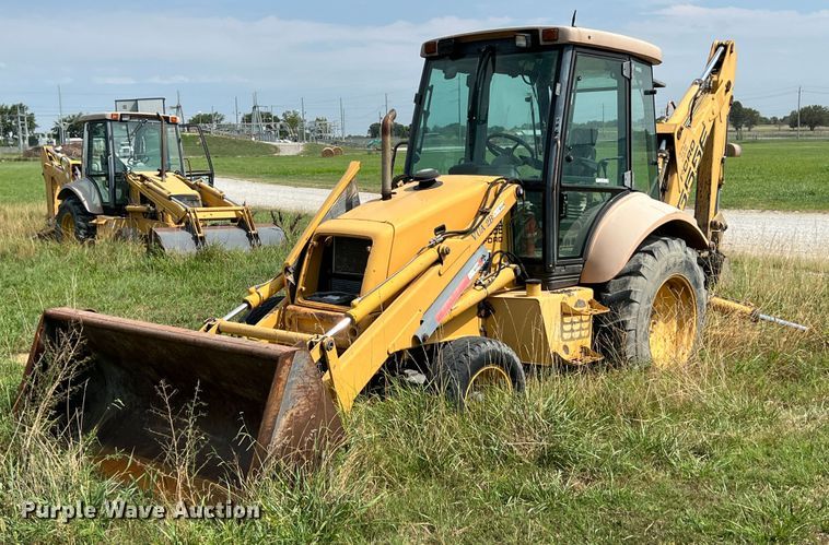 1997 New Holland 555E  backhoe - JX9483