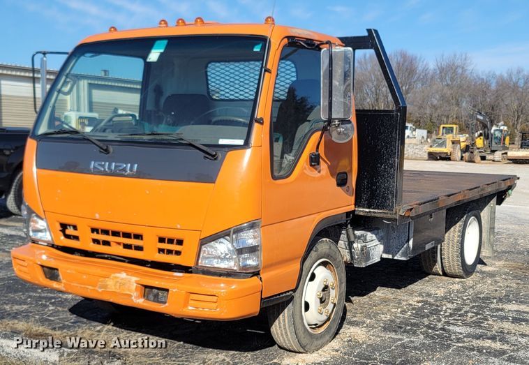 2007 Isuzu NQR  flatbed truck - MH9690