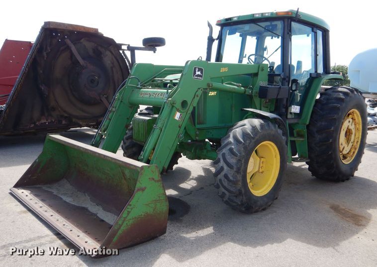 1999 John Deere 6310 MFWD tractor - DN8680