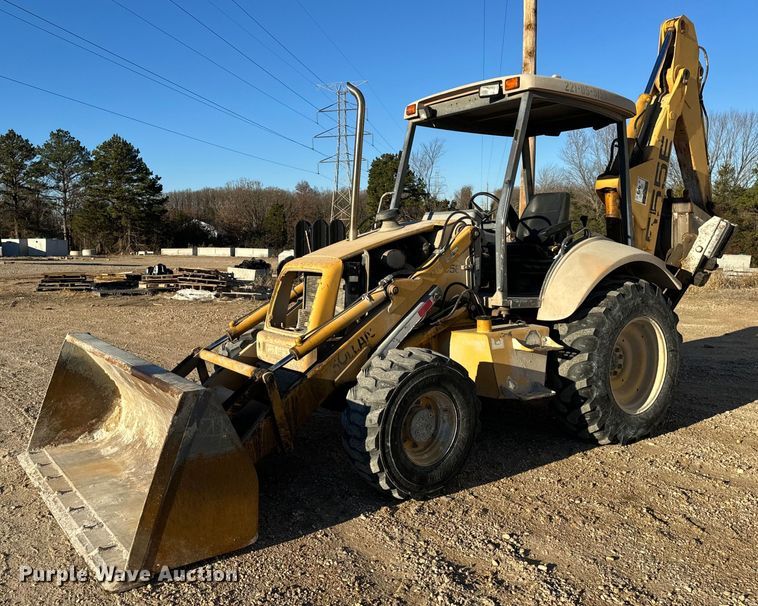1999 New Holland 555E  backhoe - NM9107