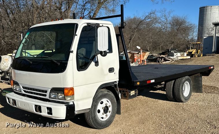 1999 Isuzu NPR flatbed truck - NJ9494