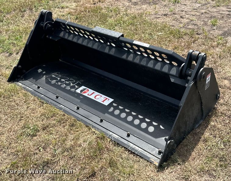 JCT Attachments four-in-one skid steer bucket - DX1198
