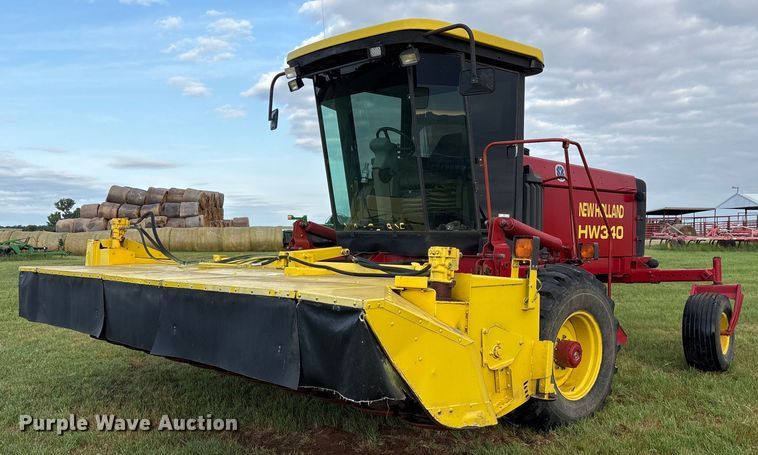 1999 New Holland HW340 swather / windrower - DY0539
