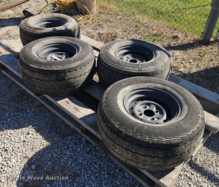 (4) Carlisle Industrial Trax 25x10.50-12 tires and wheels - EO4740