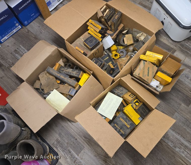 (4) boxes of Caterpillar and Komatsu parts - ES2609