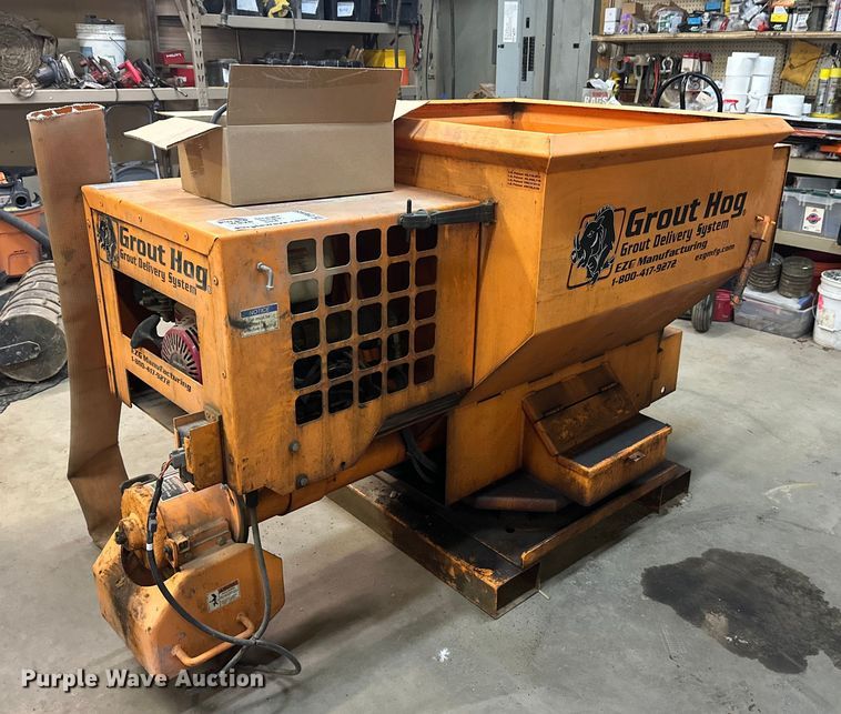 Grout hog material delivery system - DW4450