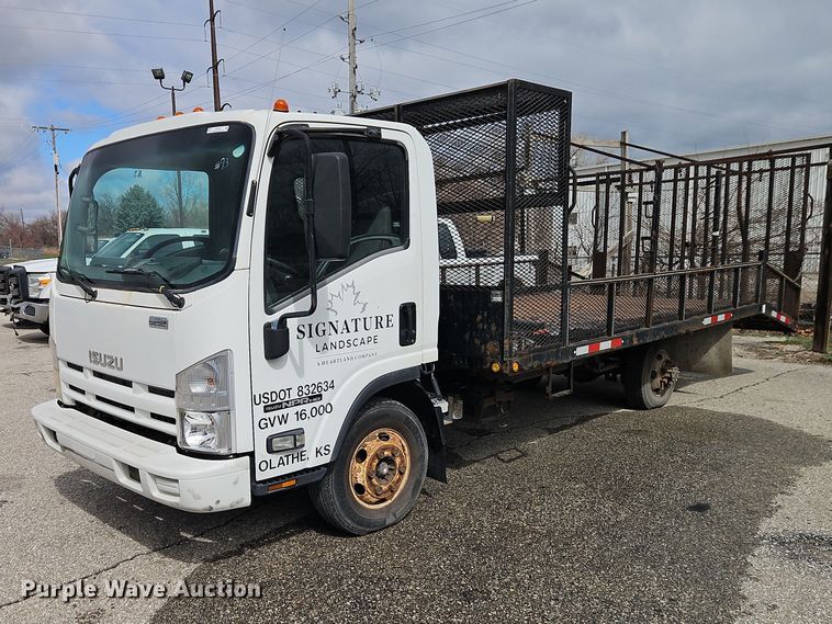 2010 Isuzu NPR flatbed truck - EO7089