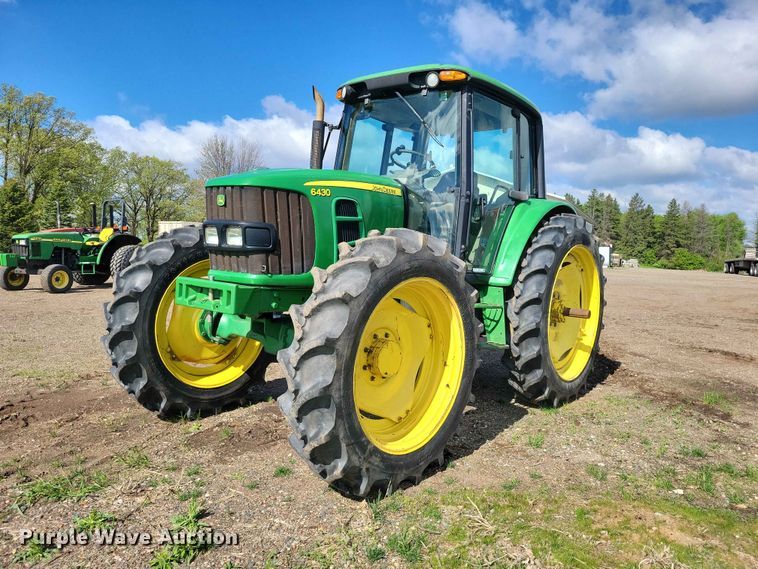 2011 John Deere  6430 MFWD tractor - DZ7154