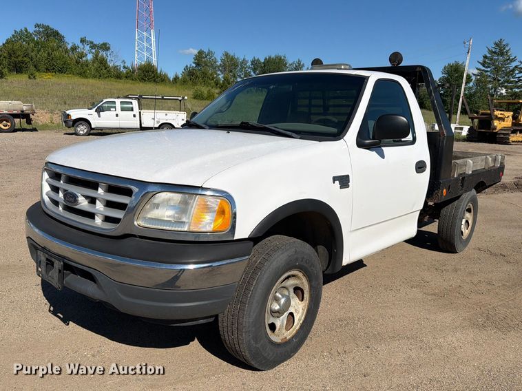 1999 Ford F150 flatbed pickup truck - DQ7920