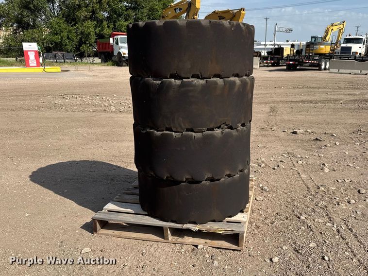 (4) Dobermann skid steer tires and wheels - NJ9182