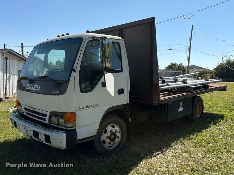 1999 Isuzu NPR flatbed truck - FC3385