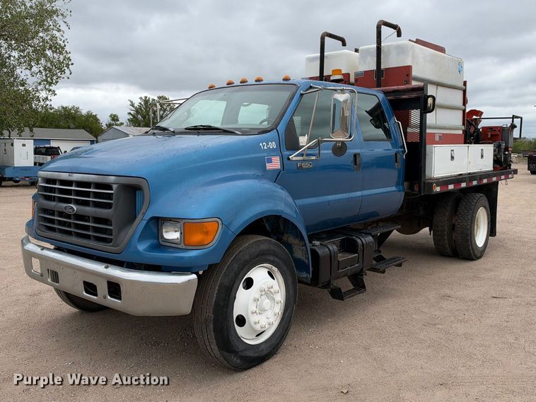 2000 Ford F650 flatbed truck with Ditch Witch fluid mixing system - EC4617